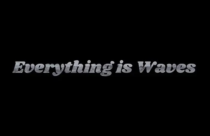 Title card for the documentary Everything Is Waves, with the title in silver script on black.