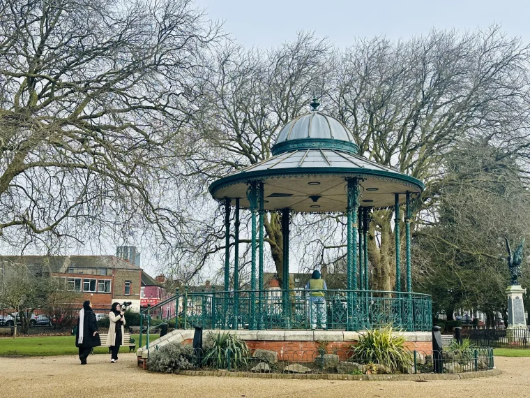 Crew filming the subject of Ya Bilaadi in an ornate Victorian park bandstand in Cardiff, behind the scenes.