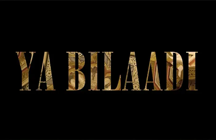 Title card for the documentary Ya Bilaadi, the title in gold lettering on black.